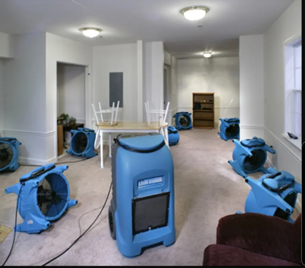 Air movers and dehumidifier setup for Water Damage Restoration in Slinger